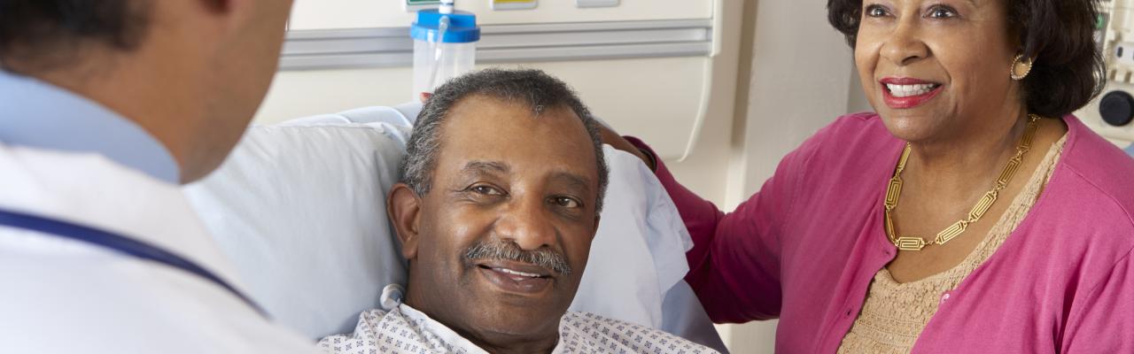 Doctor Explaining Procedure To Patient and Spouse